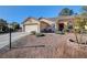 Single-story home with attractive landscaping and a two-car garage at 5105 Kingsbridge Dr, Las Vegas, NV 89130