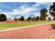 Green grass and red dirt landscape at 5105 Kingsbridge Dr, Las Vegas, NV 89130