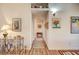 Bright hallway with decorative artwork and wood flooring at 5105 Kingsbridge Dr, Las Vegas, NV 89130