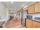 Kitchen with stainless steel appliances and view into living room at 5105 Kingsbridge Dr, Las Vegas, NV 89130