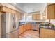 Modern kitchen with stainless steel appliances and wood cabinets at 5105 Kingsbridge Dr, Las Vegas, NV 89130