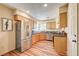 Bright kitchen features wood cabinets, stainless steel appliances, and granite countertops at 5105 Kingsbridge Dr, Las Vegas, NV 89130