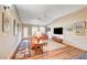 Bright living room area with natural light, cozy seating, and wood-look flooring at 5105 Kingsbridge Dr, Las Vegas, NV 89130