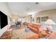 Spacious living room with an open layout, wood-look flooring, and ample seating at 5105 Kingsbridge Dr, Las Vegas, NV 89130