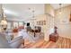 Bright, open-concept living and dining area with wood floors and vaulted ceilings at 5105 Kingsbridge Dr, Las Vegas, NV 89130