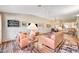 Open living room with hardwood floors and a view of the dining area at 5105 Kingsbridge Dr, Las Vegas, NV 89130
