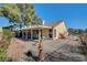 Cozy backyard patio with seating area and gravel at 5105 Kingsbridge Dr, Las Vegas, NV 89130