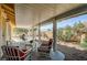 Relaxing covered patio with wicker furniture and view of backyard at 5105 Kingsbridge Dr, Las Vegas, NV 89130