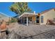 Backyard patio with seating area and gravel at 5105 Kingsbridge Dr, Las Vegas, NV 89130