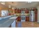 Well-equipped kitchen featuring stainless steel appliances and dark wood cabinets at 5529 Eagle Claw Ave, Las Vegas, NV 89130