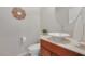 Bathroom with decorative vanity sink, toilet, and neutral color scheme at 5988 Pirates Delight Ave, Las Vegas, NV 89139