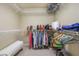 Walk-in closet with wire shelving, hanging clothes, and storage for bags and accessories at 5988 Pirates Delight Ave, Las Vegas, NV 89139