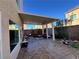 Covered patio with outdoor seating and view of the yard at 5988 Pirates Delight Ave, Las Vegas, NV 89139