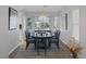 Dining room with natural light provided by a large bay window and a decorative chandelier above table at 6308 Canyon Ridge Dr, Las Vegas, NV 89108