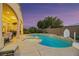 Beautiful backyard with a pool, spa, and spacious patio area at 6425 Orto Botanico Ct, Las Vegas, NV 89131