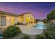 Lush backyard featuring a sparkling pool and a covered patio for outdoor relaxation at 6425 Orto Botanico Ct, Las Vegas, NV 89131