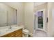 Bathroom featuring a single sink vanity, neutral tones, and walk-in shower at 6425 Orto Botanico Ct, Las Vegas, NV 89131