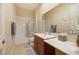 Bathroom with a shower over tub, neutral color palette, and single sink vanity at 6425 Orto Botanico Ct, Las Vegas, NV 89131