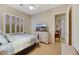 Bedroom with a shuttered window, ceiling fan, and a television at 6425 Orto Botanico Ct, Las Vegas, NV 89131