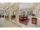 Formal dining room featuring a chandelier, shuttered windows, and an ornate rug at 6425 Orto Botanico Ct, Las Vegas, NV 89131