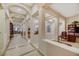 Expansive foyer with tile floors, arched columns, and views into the home's other rooms at 6425 Orto Botanico Ct, Las Vegas, NV 89131
