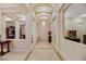 Elegant foyer with arched doorways, tile flooring, and a chandelier creates a grand entrance to the home at 6425 Orto Botanico Ct, Las Vegas, NV 89131