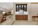 Hallway with tile floors, wine bar and views of the dining room and kitchen at 6425 Orto Botanico Ct, Las Vegas, NV 89131