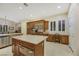 Bright kitchen with stainless steel appliances, large island, tile floors, breakfast nook, and plenty of counter space at 6425 Orto Botanico Ct, Las Vegas, NV 89131