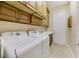 Well-equipped laundry room featuring overhead storage and a utility sink at 6425 Orto Botanico Ct, Las Vegas, NV 89131