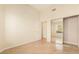 Bright bedroom with hardwood floors and a mirrored closet at 6914 Emerald Springs Ln, Las Vegas, NV 89113