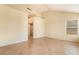 Bedroom features hardwood floors, neutral walls, a walk-in closet, and a window with blinds at 6914 Emerald Springs Ln, Las Vegas, NV 89113