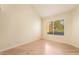 Bright bedroom with hardwood floors, neutral walls, and a window with blinds at 6914 Emerald Springs Ln, Las Vegas, NV 89113