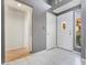 Bright entryway with white tile flooring, decorative glass, and access to other rooms at 6914 Emerald Springs Ln, Las Vegas, NV 89113