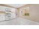 Functional kitchen featuring white appliances and ample counter space for easy meal preparation at 6914 Emerald Springs Ln, Las Vegas, NV 89113