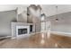 Bright living room with a fireplace, vaulted ceilings, and modern flooring at 6914 Emerald Springs Ln, Las Vegas, NV 89113