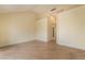 Spacious living room features hardwood floors, neutral walls, and ample space for furniture at 6914 Emerald Springs Ln, Las Vegas, NV 89113