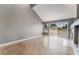 Bright and airy living room with hardwood floors, a fireplace, and a sliding glass door at 6914 Emerald Springs Ln, Las Vegas, NV 89113