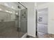 Modern bathroom with a large glass shower and gray tile at 7646 Sandhaven St, Las Vegas, NV 89139