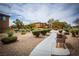 A community park showcases meandering walkways and lush landscaping for residents to enjoy at 8063 Sundance Valley Dr, Las Vegas, NV 89178