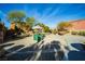 Neighborhood playground featuring a slide and a sandbox, complemented by community landscaping at 8063 Sundance Valley Dr, Las Vegas, NV 89178