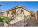 Covered patio, artificial turf, and brick pavers at 8109 Mountain Forest Ct, Las Vegas, NV 89129