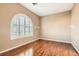 The bedroom features hardwood floors and large windows at 8109 Mountain Forest Ct, Las Vegas, NV 89129