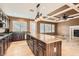 Kitchen with granite island, dark wood cabinets and stainless steel appliances at 8109 Mountain Forest Ct, Las Vegas, NV 89129