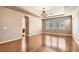 Spacious living room with hardwood floors, neutral paint, and a decorative chandelier at 8109 Mountain Forest Ct, Las Vegas, NV 89129