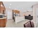 Kitchen with an island, stainless steel appliances, and wood cabinets at 8220 Redbud Vine St, North Las Vegas, NV 89085