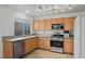 Bright kitchen with light wood cabinets and stainless steel appliances at 8388 Montgomery St, Las Vegas, NV 89123