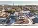 This aerial view shows the property and neighborhood with the airport in the background at 889 Monika Way, Las Vegas, NV 89119