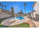 Backyard featuring a large in-ground pool, diving board, and steps to a two-story home at 889 Monika Way, Las Vegas, NV 89119