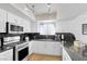 Modern kitchen with stainless steel appliances and granite counters at 9377 Lotus Elan Dr, Las Vegas, NV 89117