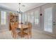 Charming dining room with wooden table and chairs, and built-in hutch at 10236 Rio De Thule Ln, Las Vegas, NV 89135